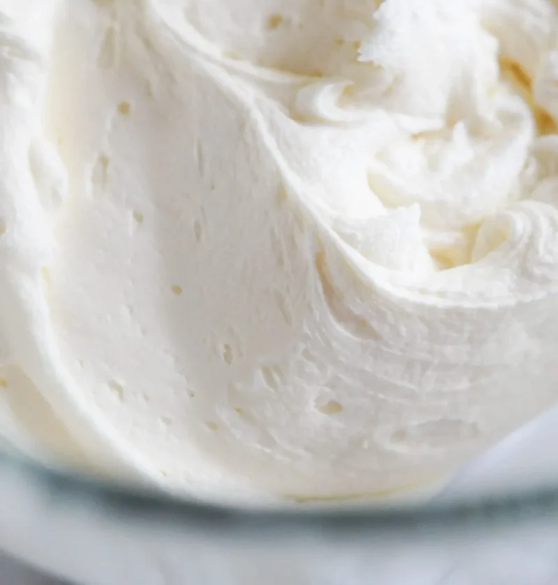 pioneer woman american buttercream frosting swirled in a bowl with a spatula