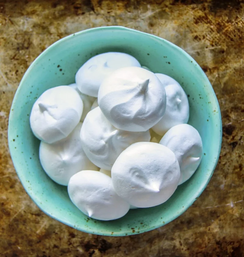 Aquafaba meringue cookies on a baking sheet made from pioneer woman aquafaba 101 recipe
