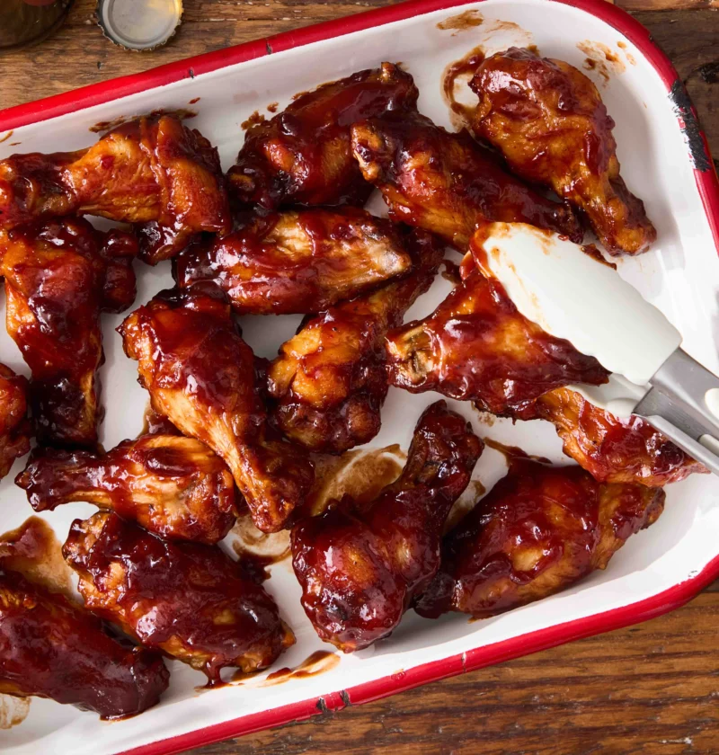Crispy BBQ chicken wings glazed with smoky chipotle barbecue sauce on a plate