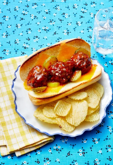 Pioneer Woman BBQ meatball subs loaded with saucy beef meatballs and melted cheddar on hero rolls